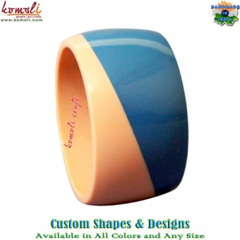 Angular design of pink and blue resin bangle bracelet
